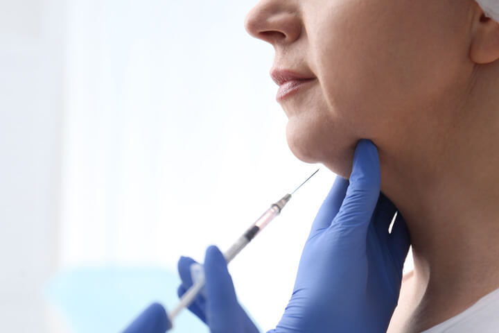 woman getting a kybella injection
